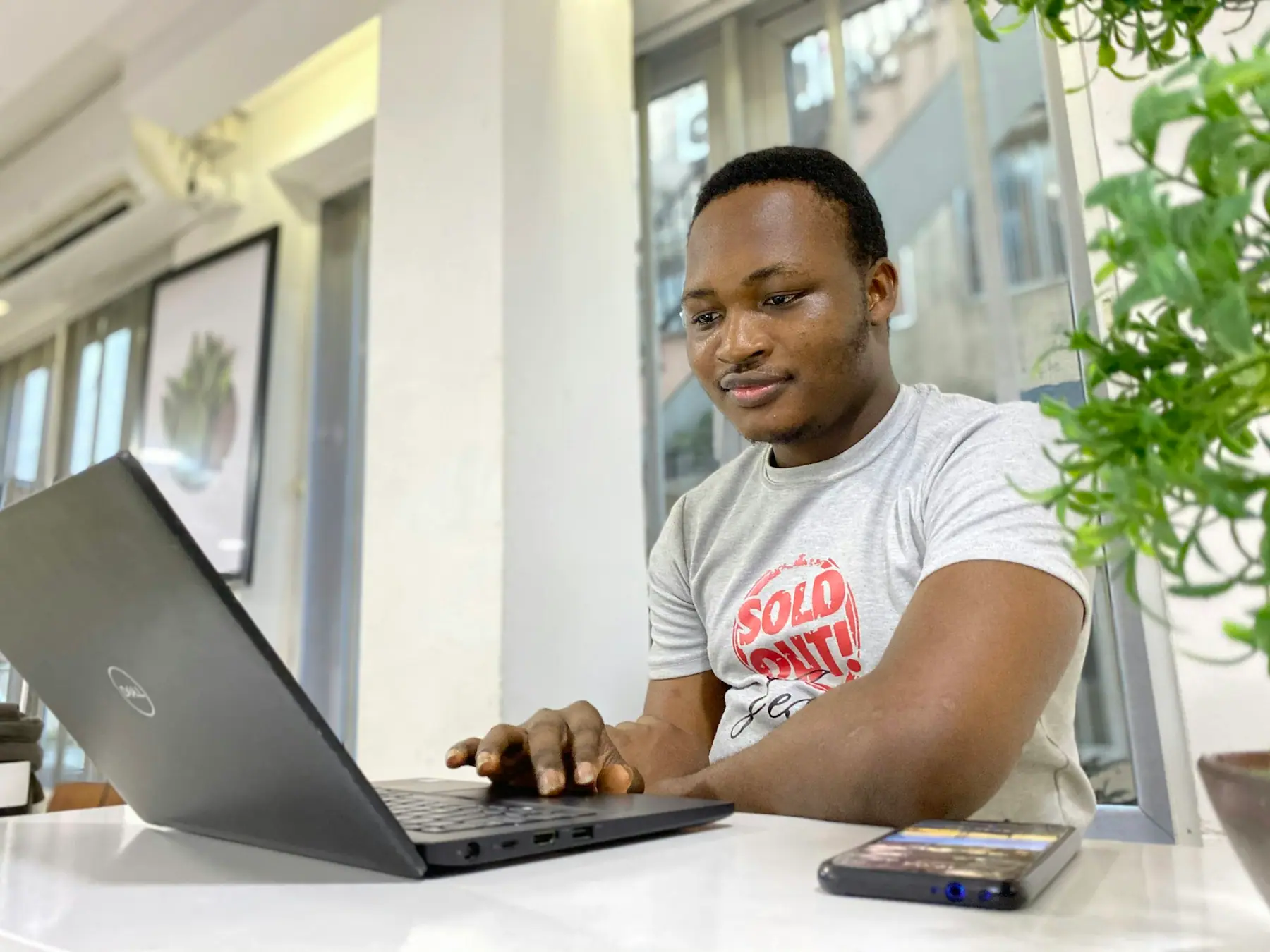 Entrepreneur reviewing his website on a laptop